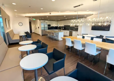 Office Renovation Markham, Ontario – Custom millwork detailing solutions that seamlessly integrate functional cabinetry, appliance accommodation and optimized storage across key spaces including the pantry, reception desk and office storage areas.